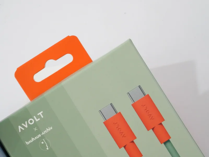 Matte laminated printed carton for charging cables with an orange paper hanger