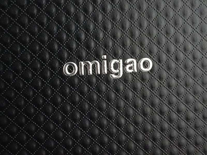 Silver foil stamped lettering on a black quilted textured box
