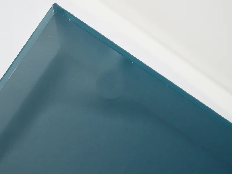 Magnetic closure hidden under the paper wrap at the corner of a teal rigid box
