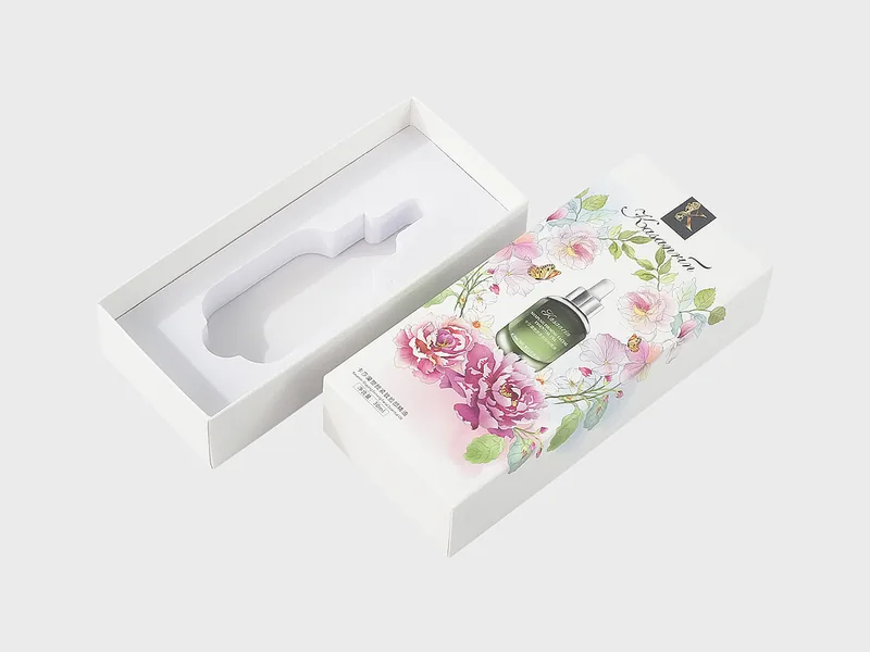 Lid and base box with the printed floral lid set aside, showing the molded pulp insert inside the base