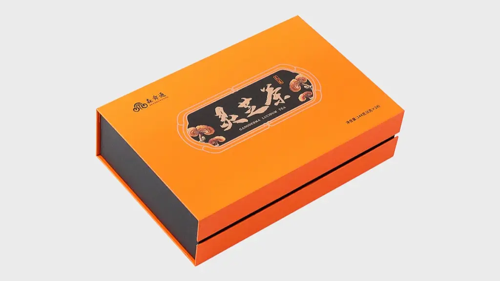 Premium orange supplement packaging box shown from an angled perspective with elegant branding and product illustration on the lid